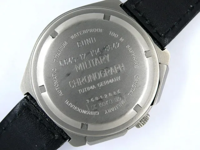 Titandeckel der Titan-Vorserie mit ziviler Prägung und zusätzlicher Versorgungsnummer.