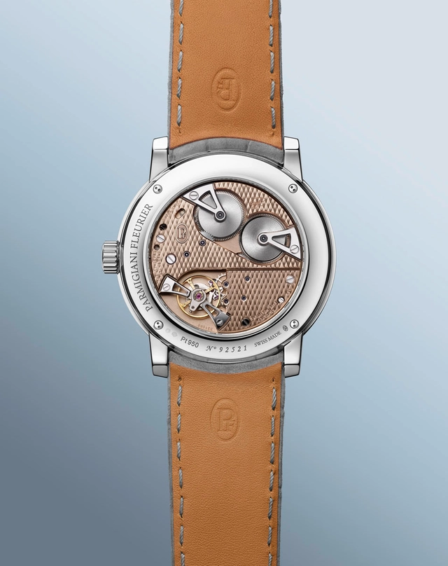 Parmigiani Toric Petite Seconde Platin Golden Hour Blick aufs Werk durch den Glasboden