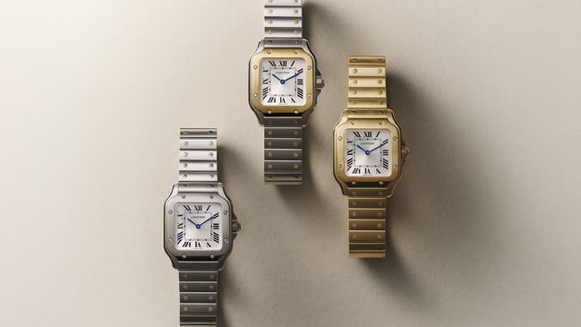 Drei Uhren, Santos de Cartier in Edelstahl und Gold