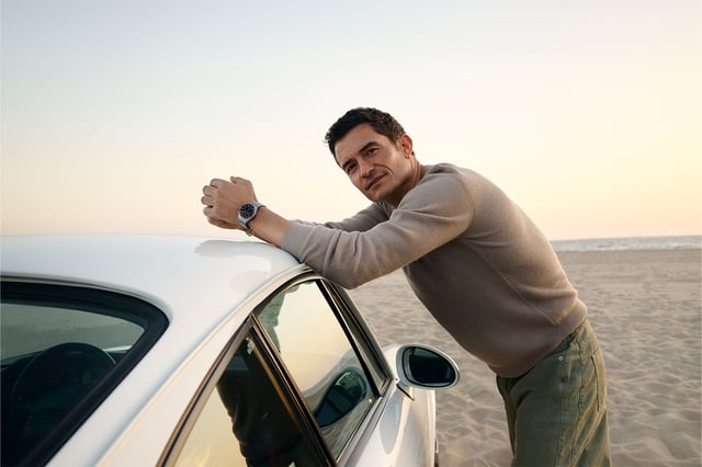 Porsche Design – Chronograph 1 All Titanium am Handgelenk von Orlando Bloom